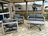 Full patio set showing two chairs, loveseat, table, cushions, frame style