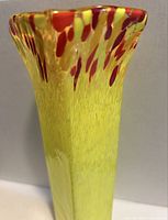 Close-up of flared rim showing red/orange accents and glass texture