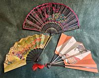 Overview of all three folding fans displayed open