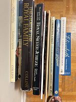 Spines of nine royal-themed books and booklets