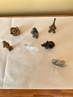 All seven miniature items arranged on paper