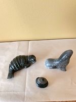 All three soapstone figurines grouped together