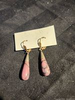 Front view of both earrings on card