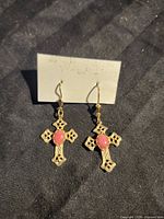 Front view of pair showing crosses with pink cabochons
