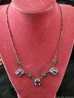 Full view of necklace on display bust