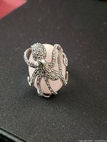Front view of ring showing octopus and cabochon