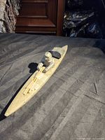 Full view of soapstone kayak sculpture profile