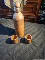 stoneware bottle with two cups front view