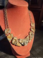Front view showing full necklace on display bust