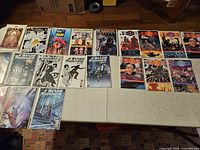 Table view of assorted comic books, multiple titles visible