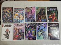 All ten comics laid out front covers visible