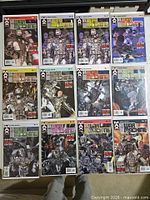All eleven comics laid out in two rows showing covers and numbering