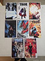 Seven Thor comics laid out on table