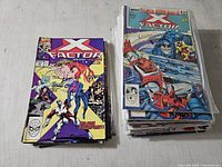 Two stacks of X-Factor comics, left smaller stack, right larger stack topped by Annual #4