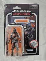 Front view of sealed Mandalorian figure on Kenner card