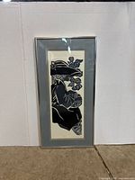 Front view of framed linocut print showing image, mat, and frame