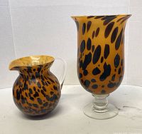 Pitcher and footed vase front view showing pattern and shapes