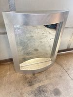 Front view of silver framed mirror