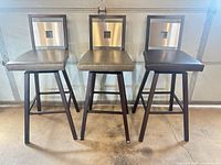Front view of three matching bar stools