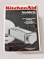 Retail box front showing KitchenAid KPRA Pasta Roller Set