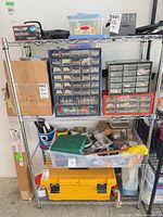 Entire chrome wire shelving unit loaded with items for scale