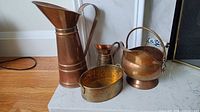 Group shot of all four copper and brass items