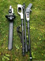 Lithnell pole chainsaw and hedge trimmer set showing all components laid out on grass