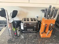 Group view: toaster, blender jar, knife block, utensils, peeler