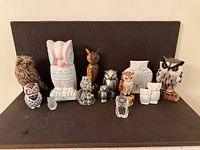 Front view showing full assortment of owl figurines on shelf