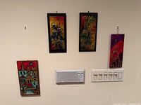 All four plaques displayed on wall