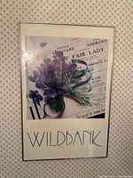 Frontal view showing entire framed poster with artwork and artist name