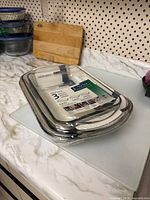 Sealed nested stack of three glass baking dishes in Anchor Hocking retail wrap on countertop