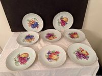 All eight fruit motif plates displayed face up