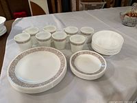 Full set of dinnerware pieces on table