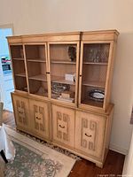 Front view of full hutch showing upper mesh doors and lower cabinet