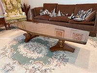 Top view of Bassett wood base coffee table with glass top