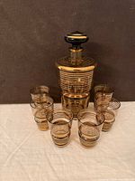 Full set showing decanter, stopper, six tumblers