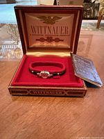 Watch, presentation box, booklet overall view