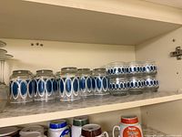 Shelf view showing complete set of tall and short tumblers