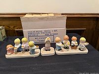Front view of all three menorah sections and original box
