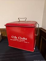 Front and lid showing Poloron Cola Cooler branding and handle