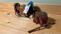 Overall view of bench grinder and vise