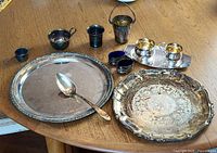 overview of all silverplate pieces on table