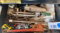 Entire drawer showing full assortment including wood plane and wrenches