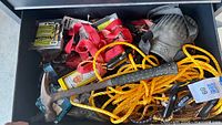 Drawer with Estwing hammer, tie-down straps, rope, knee pads, screws