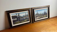 Both framed Erik Madsen landscape paintings side by side
