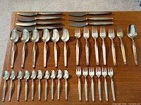 Full 36-piece Savoy flatware set laid out showing all item types and counts