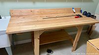 Full view of pine workbench top, backsplash and bar clamp