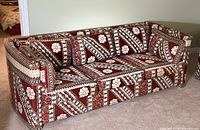 full view of Bauhaus three-seat sofa with geometric rust, brown, cream pattern