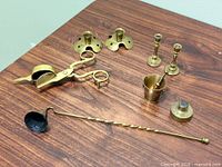 All brass items laid out on tabletop